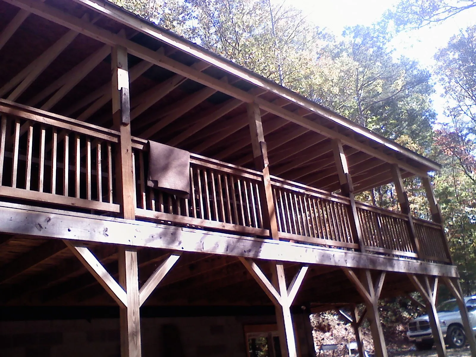 Timber framing under a new elevated porch and deck — Roof Leak Repair in Paola by Roofing Brothers